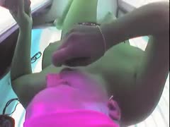 A woman is seen masturbating in a solarium in this hidden camera video.